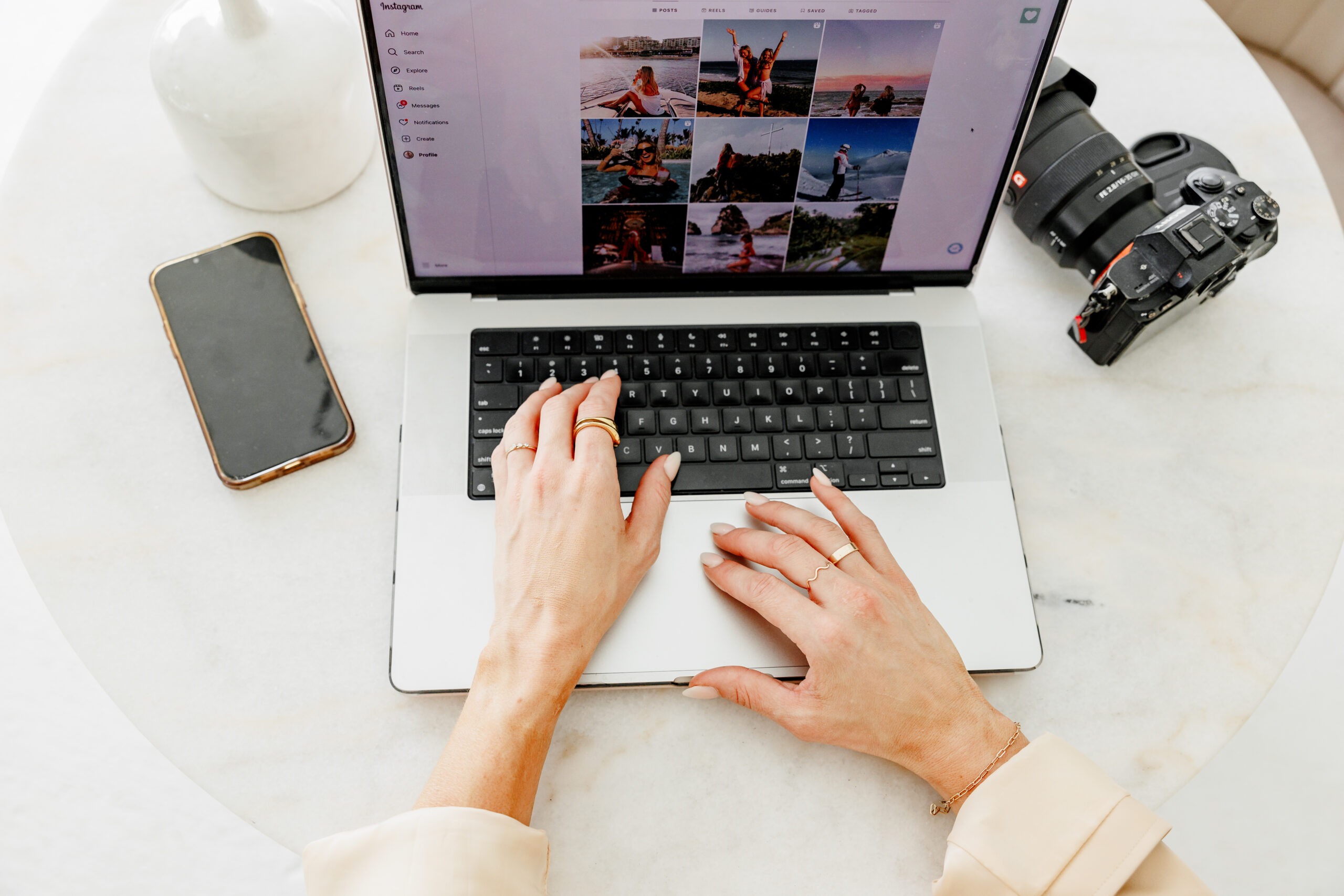 Hands typing on laptop searching on instagram